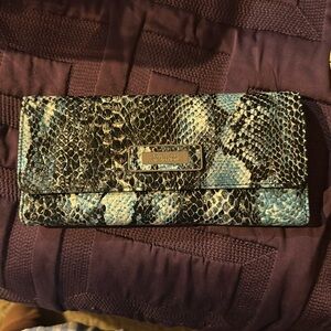 Trifold wallet 8 1/2 inches width 4 inches high 3/4 of an inch wide